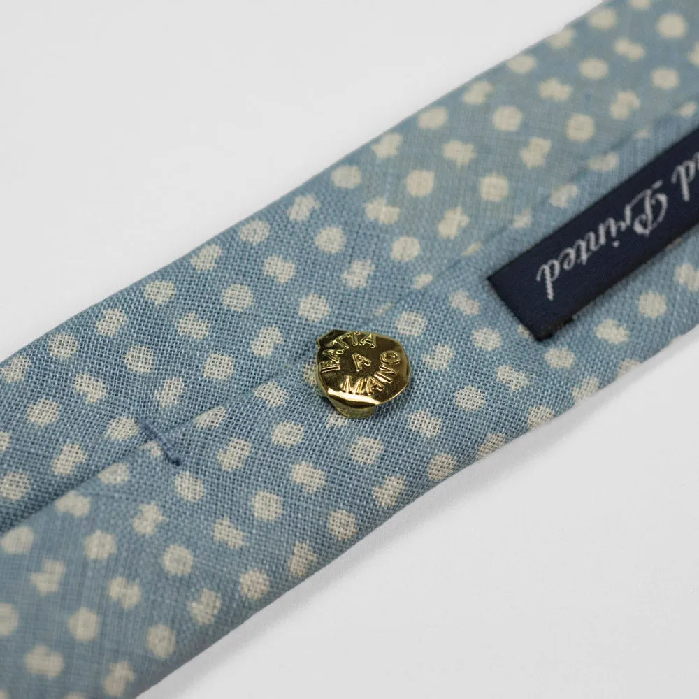 Light blue linen tie, white hand-printed flower motifs, self-tipped