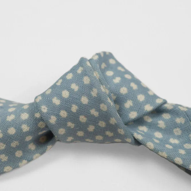 Light blue linen tie, white hand-printed flower motifs, self-tipped