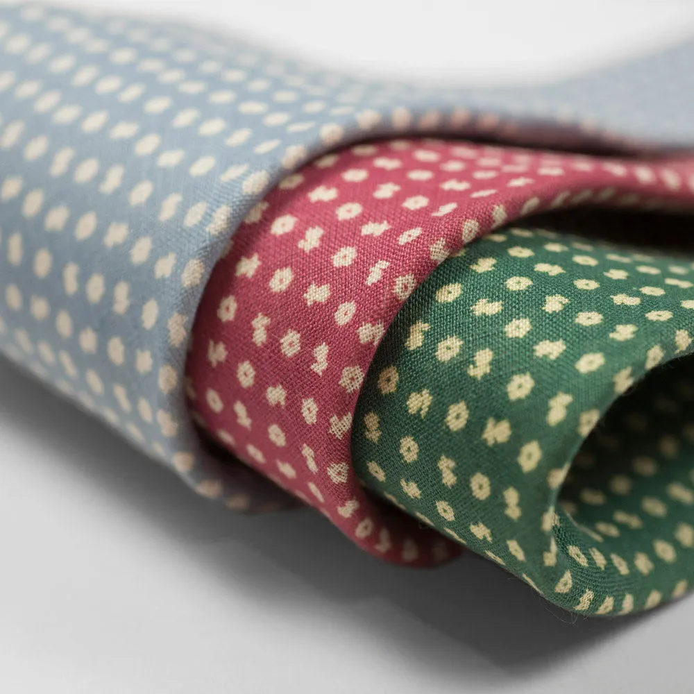 Light blue linen tie, white hand-printed flower motifs, self-tipped