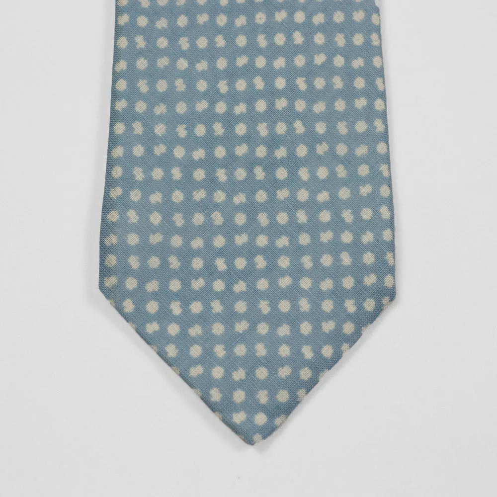 Light blue linen tie, white hand-printed flower motifs, self-tipped