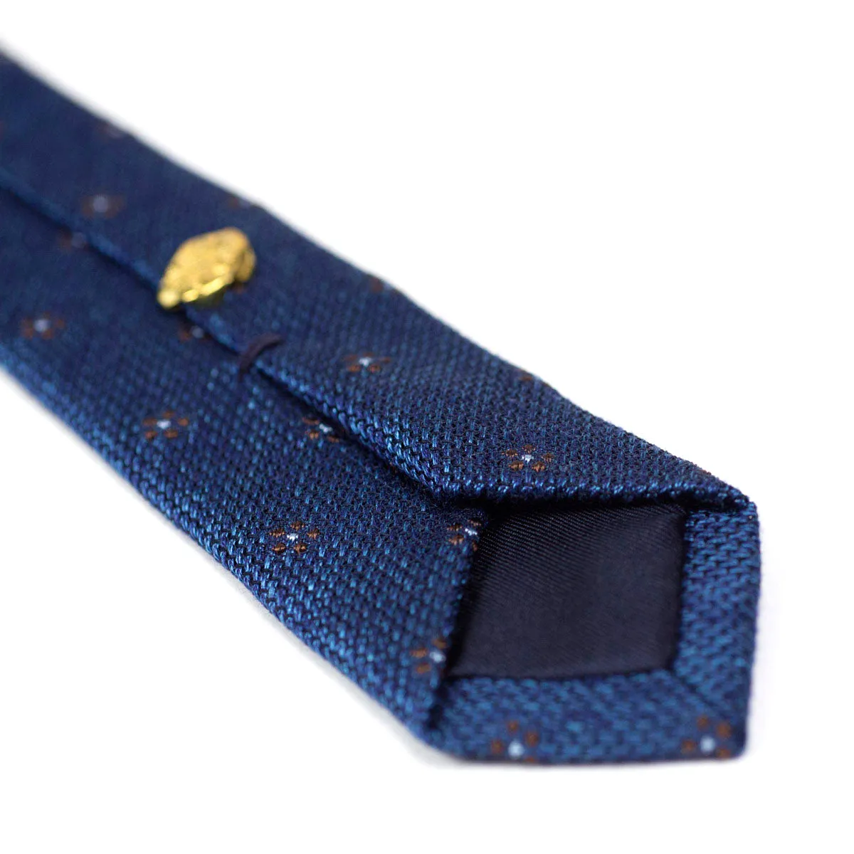 Marled blue coarsely woven silk tie, brown flower motifs
